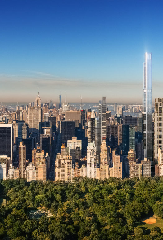 Exterior aerial view of New York City with Central Park Tower condominiums in the middle with central park in the front.