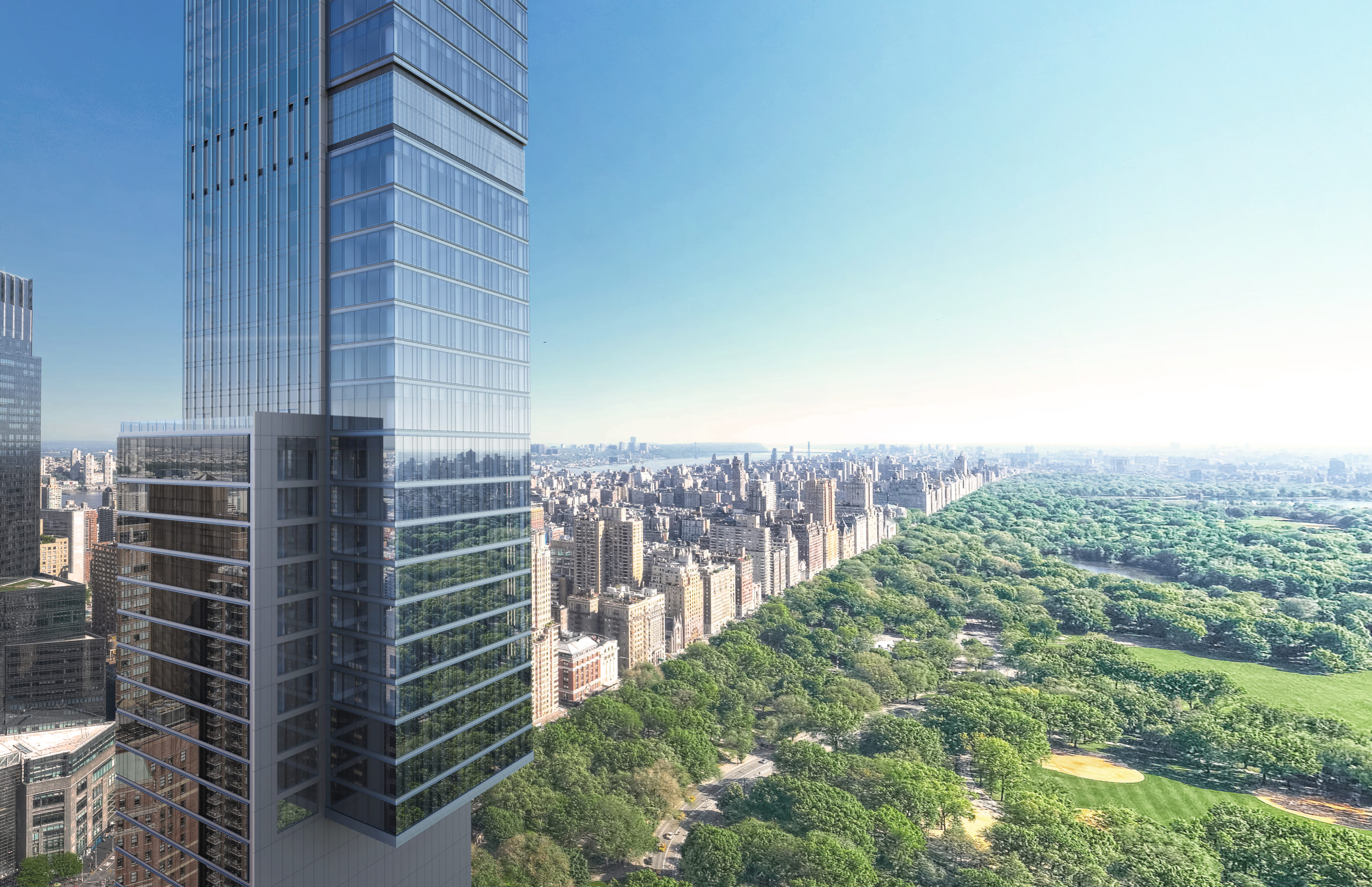 Exterior mid view of Central Park Tower condominiums in New York City and Central Park in the background.