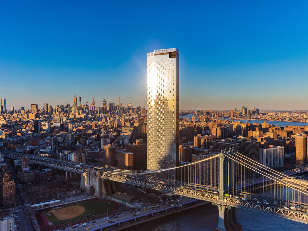 Aerial view of One Manhattan Square luxury condos in New York. Tower next to Manhattan Bridge and views of the city.