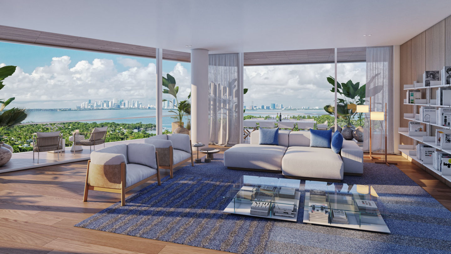 Interior view of Monaco Yacht Club residence living room with view of the ocean. Includes wood floors and white chairs.