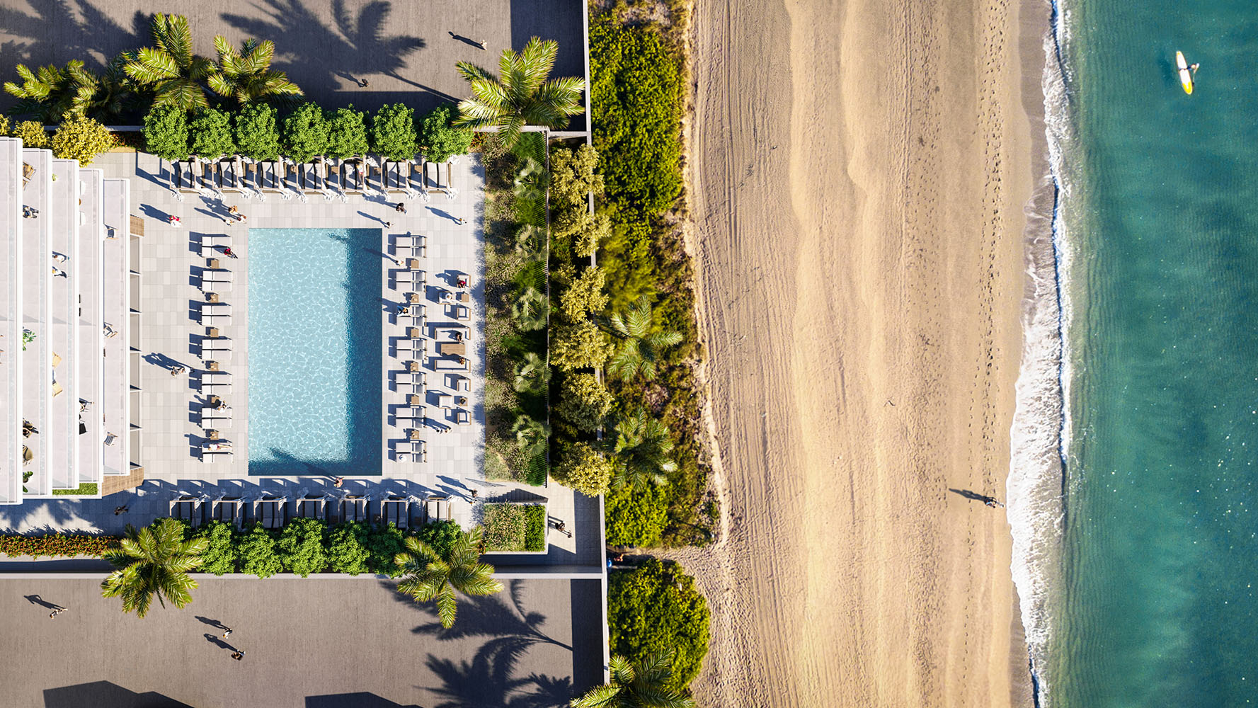 Exterior aerial view of 2000 Ocean condominium with an ocean front pool with palm trees located in Hallandale Beach, Florida.