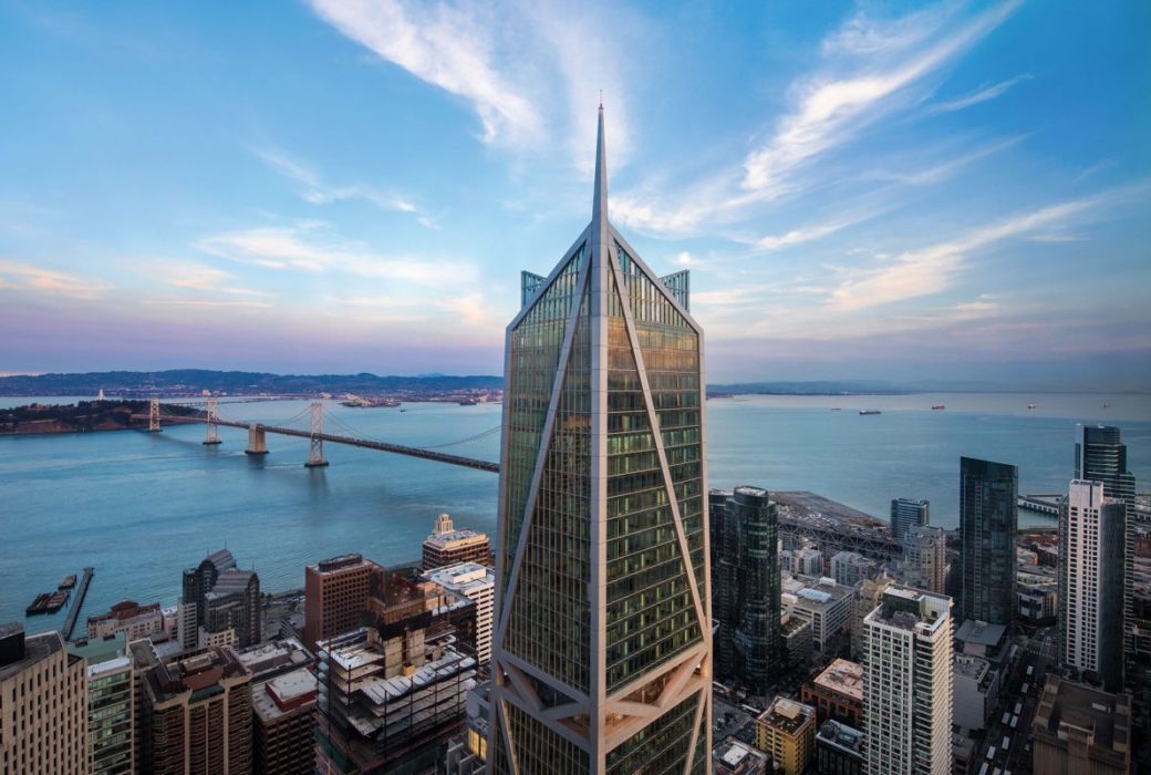 Exterior aerial view of 181 Fremont condominiums. Includes a view of river bank and other buildings in San Francisco.