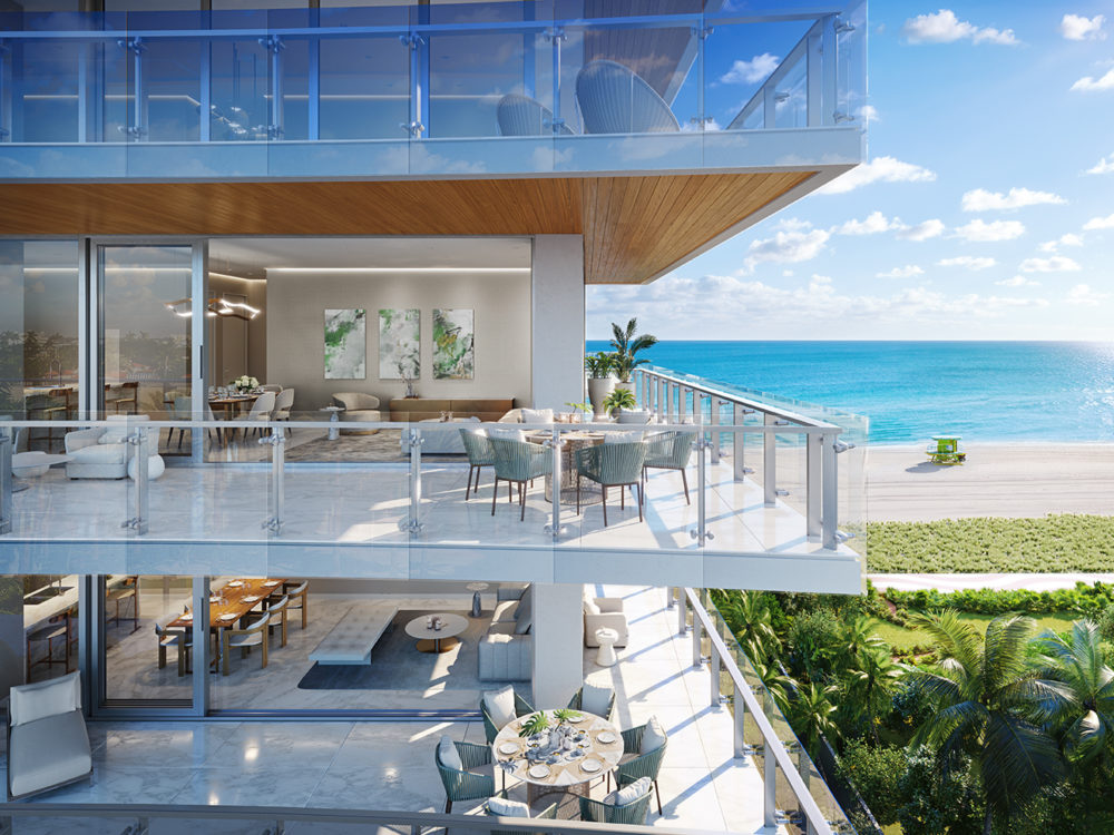 Exterior view of 57 Ocean residence balcony in Miami. Has view of oceanfront, trees and two residence balconies.