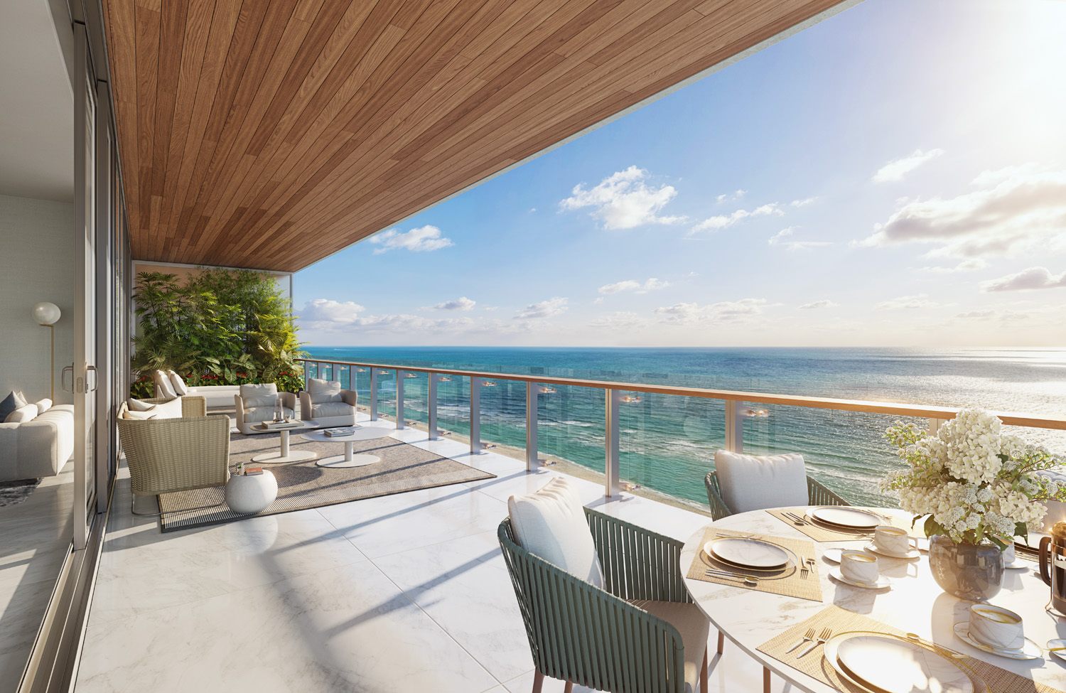 Exterior view of 57 Ocean residence balcony with ocean view in Miami. Has wood ceiling, white floors and coffee table.