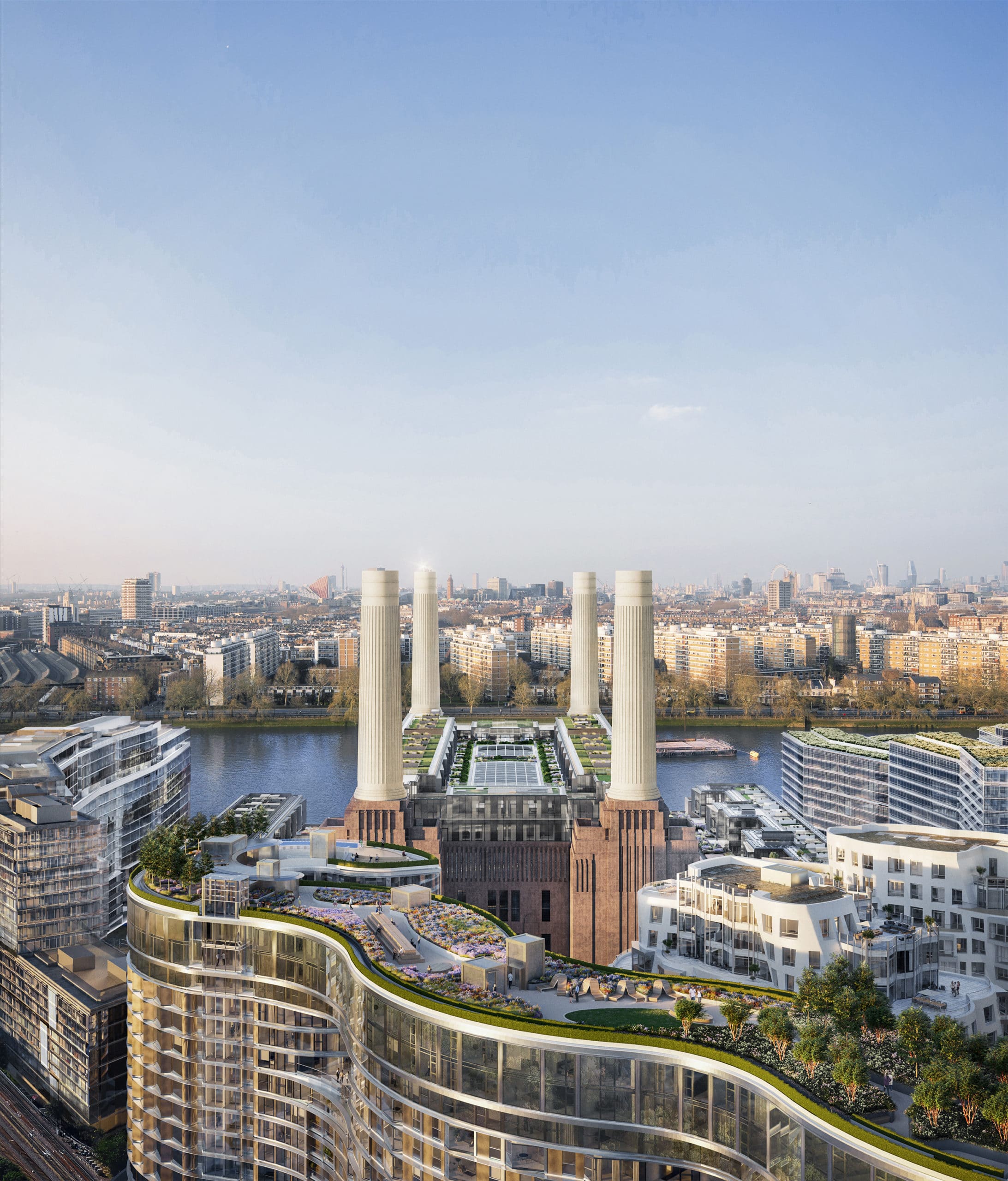 Rooftop view of Battersea Power Station and Battersea Roof Gardens on the River Thames with downtown skyline in the distance.