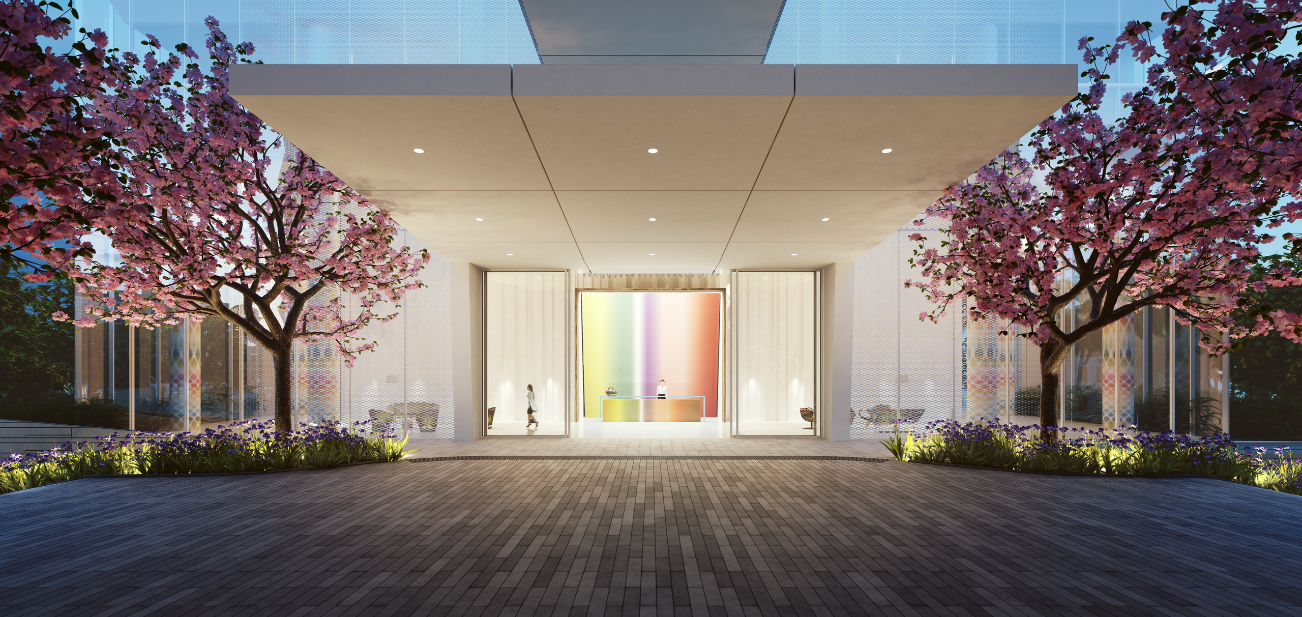 Exterior view of entrance to Missoni Baia condominiums with red trees lining the walkway. Includes Miami oceanfront view.