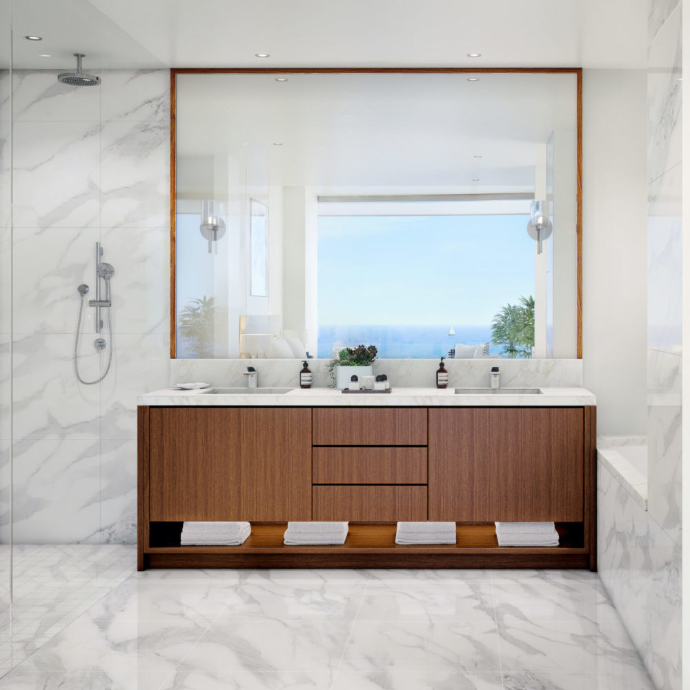 Main condo bathroom at Una Residences in Miami. White stone bathroom with standing shower, double vanity and walk-in closet.