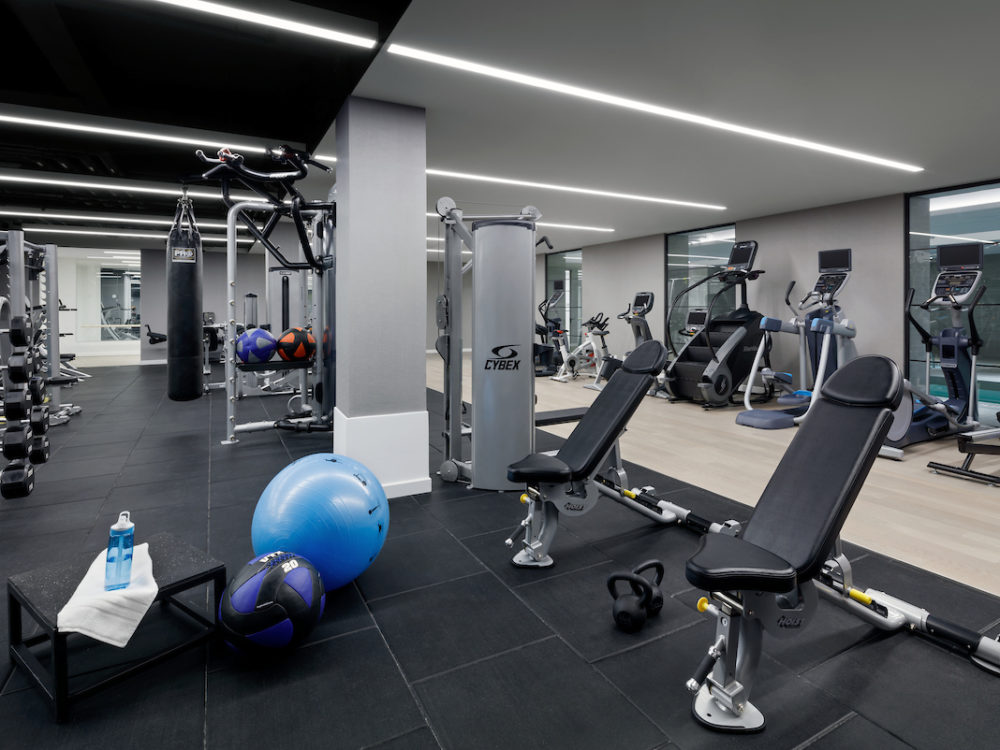 Interior view of 88 & 90 Lexington residence fitness center in New York CIty. Has cardio and weightlifting equipment.