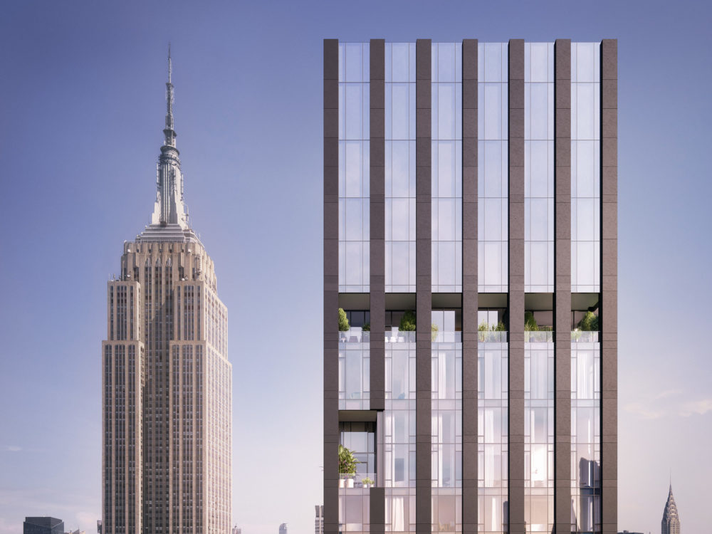 Exterior aerial view of 277 Fifth Avenue condominiums. Includes view of New York City and detailed architectural building.