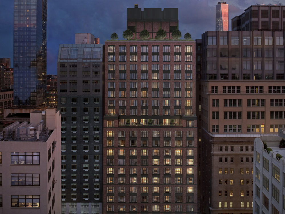 Exterior view of 70 Charlton condominiums with New York City dusk background.