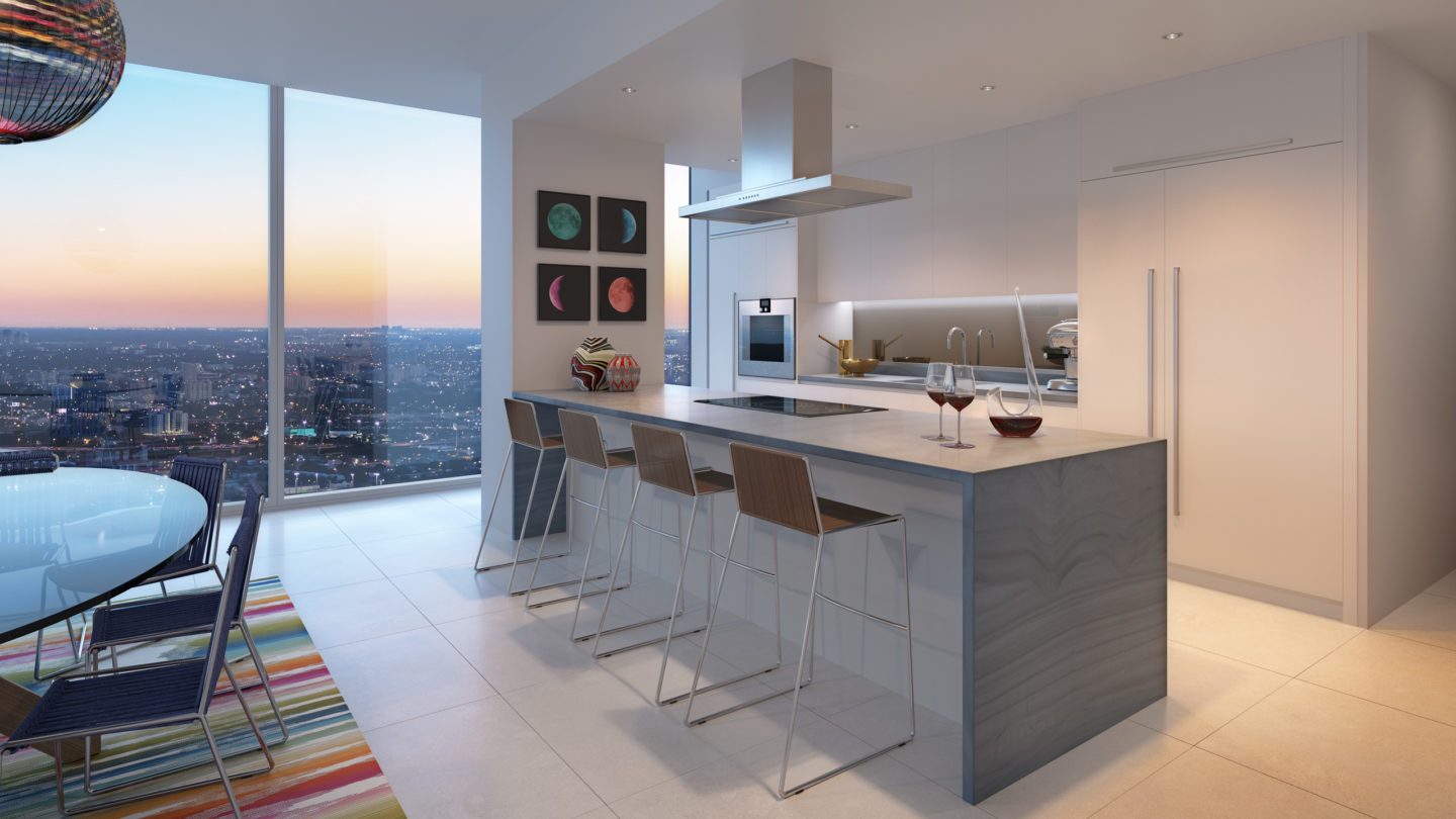 Interior view of Missoni Baia residence kitchen with white countertop island. Has window view of Miami and the ocean.