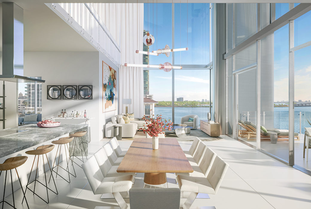 Interior view of Missioni Baia luxury townhouse kitchen. Includes a oceanfront view through transparent windows.