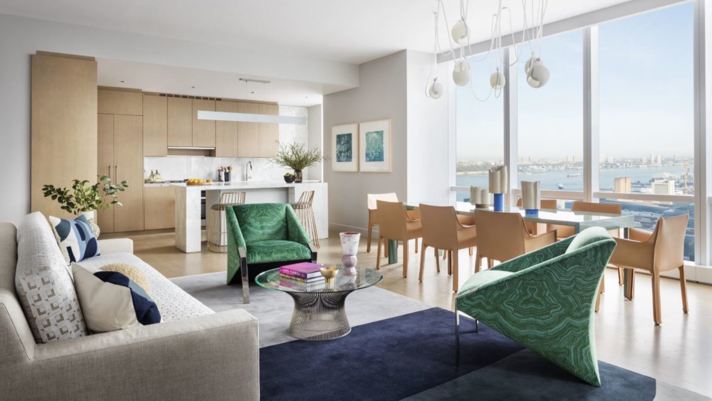 View of 15 Hudson Yards living room, dining room, and kitchen with a window view of New York City.