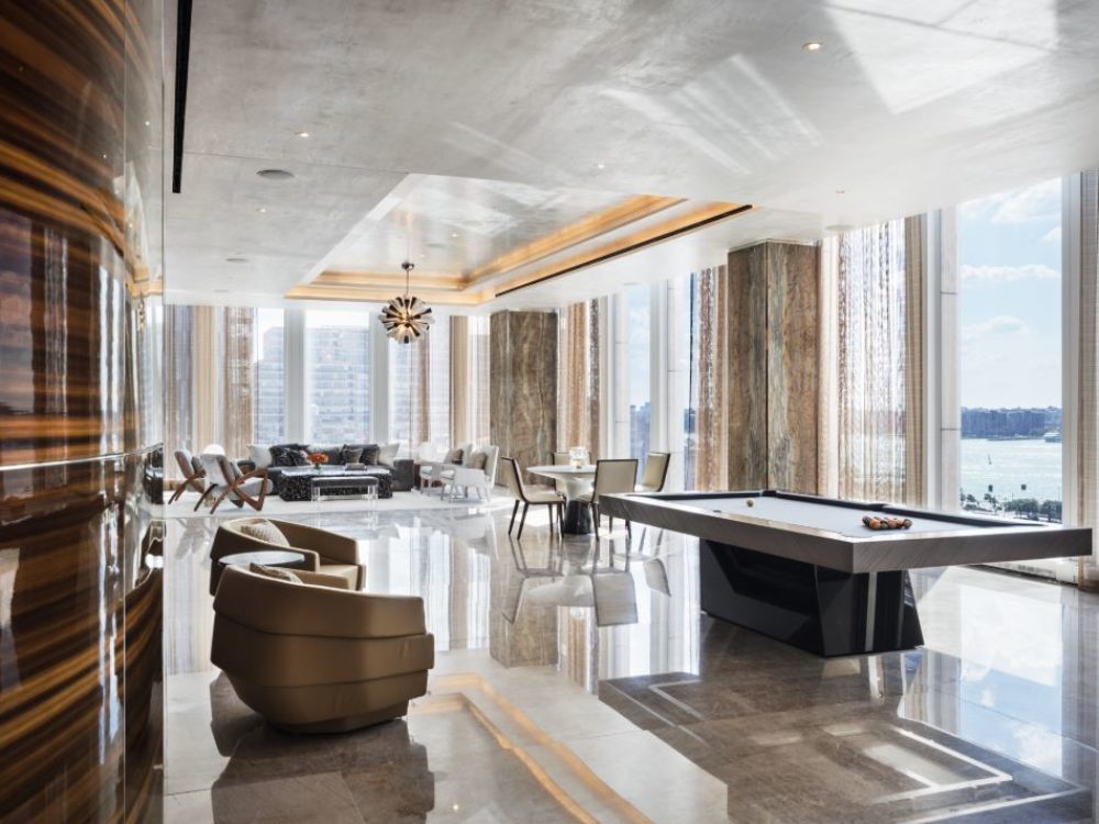 Interior view of 35 Hudson Yards residence game room and conference room includes a window view of New York City.