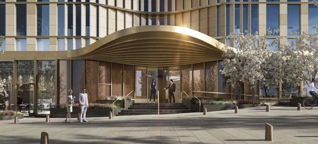 Exterior view of entrance to 35 Hudson Yards located in NYC. Includes night view with white trees and an illuminating side.