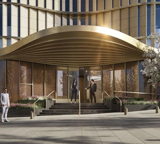 Exterior view of entrance to 35 Hudson Yards located in NYC. Includes night view with white trees and an illuminating side.