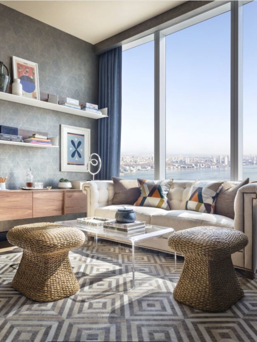 View of 15 Hudson Yards residence study room with window view of New York City. Includes a desk and couches to sit.