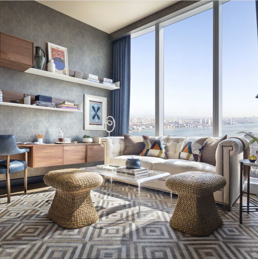 View of 15 Hudson Yards residence study room with window view of New York City. Includes a desk and couches to sit.