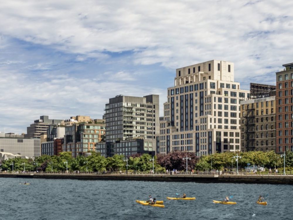 Exterior view of 70 Vestry condominiums in New York City. Has waterfront view and surrounding buildings.