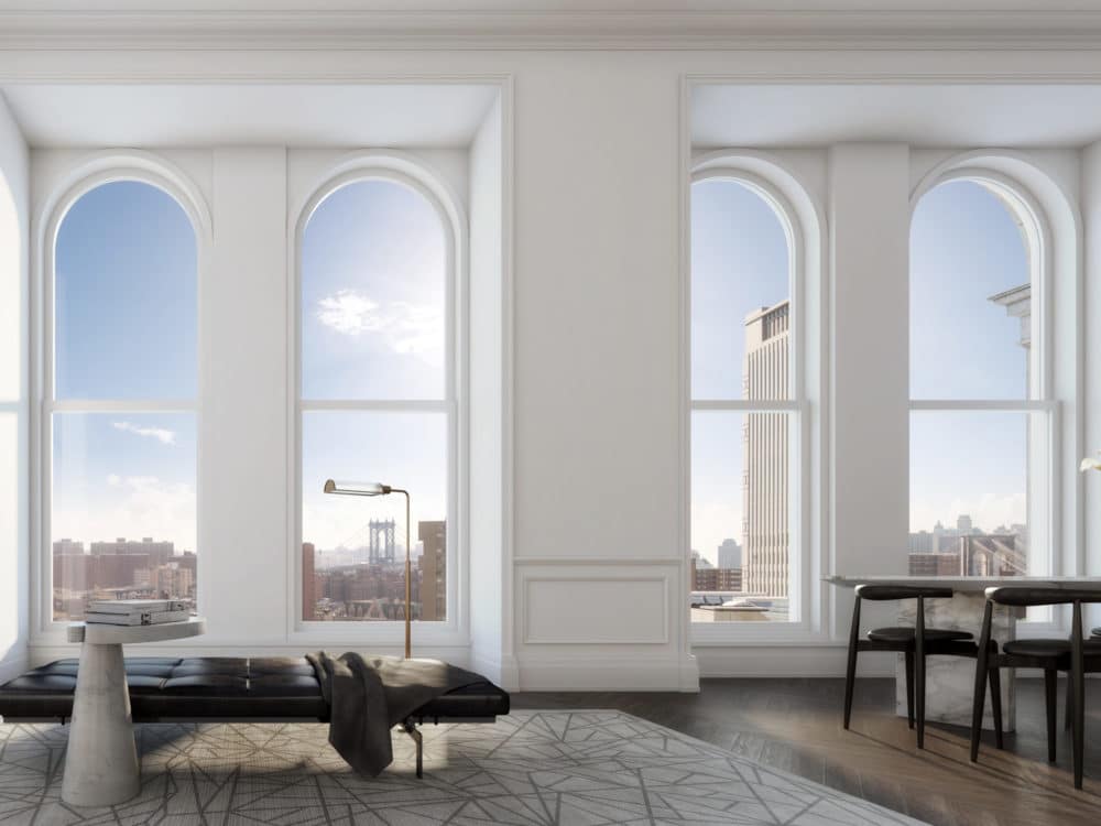 Interior residence condominium at 108 Leonard with white walls, wood flooring, and windows that overlook New York City.