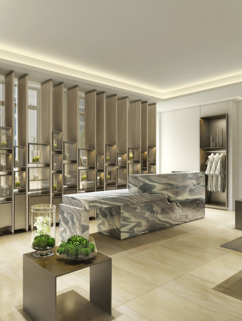 Interior view of 30 Park Place residence spa located in New York City. Has a massage table and light colored walls and floor.