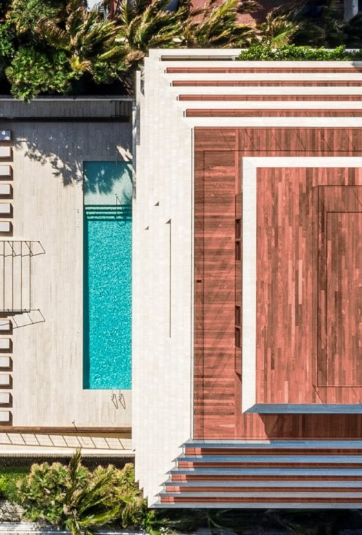 Exterior aerial view of Arte Surfside condominiums with oceanfront view. Has rooftop and front entrance pool.