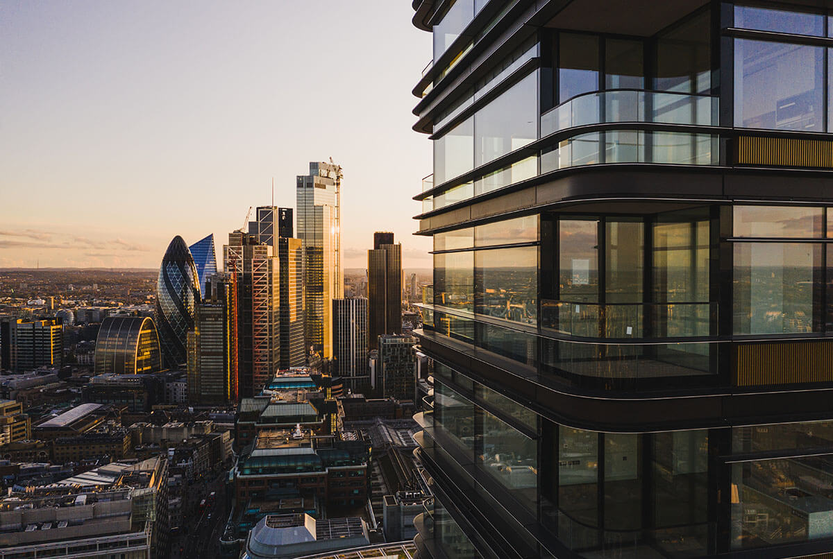 Exterior view of Principal Tower residence living in London. Has skyline buildings in the background and glass windows.