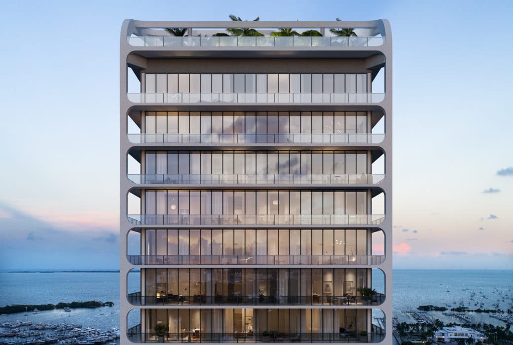 Upper floors of Mr. C Residences condominium complex in Miami. Top floors of building with glass walls overlooking marina.