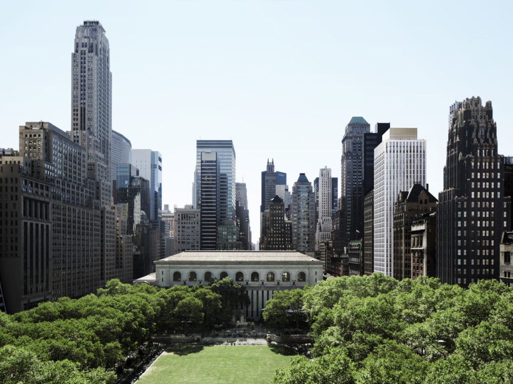 View of Bryant Park and surrounding buildings in downtown Manhattan. Exterior of The Bryant condos can be seen to the east.
