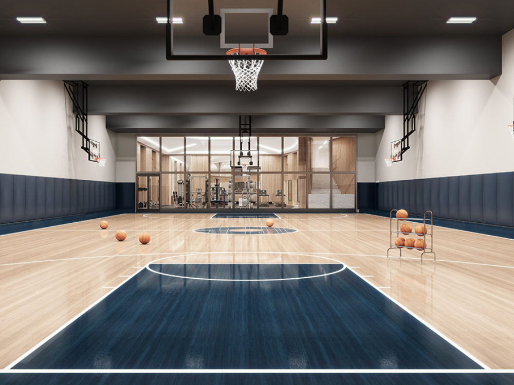Full sized basketball court with six hoops and padded walls. One of many amenities at Waterline Square luxury condos in NYC.