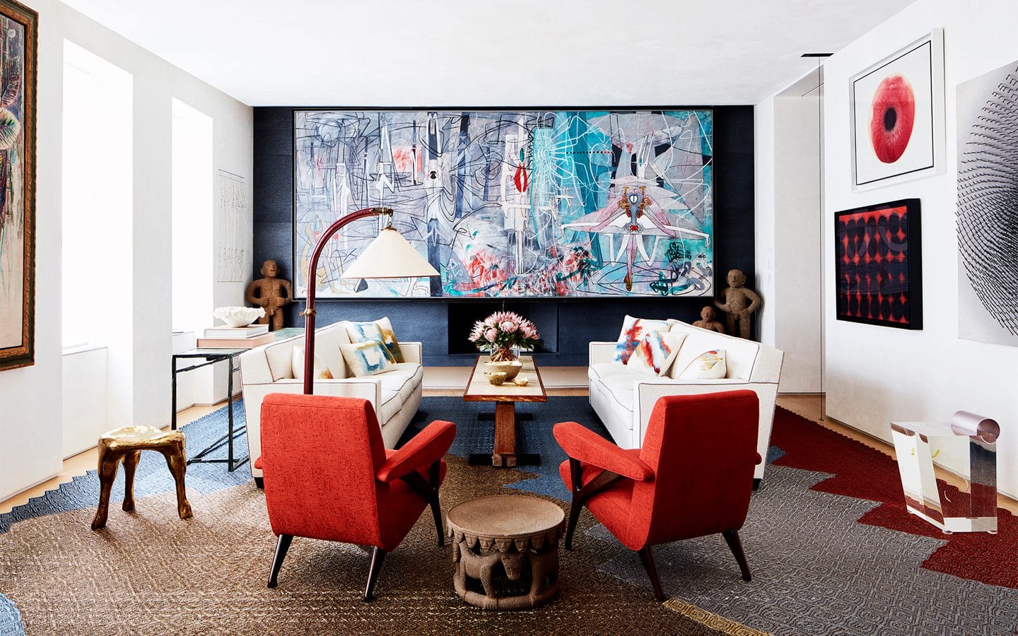 Living room with red couch and large abstract painting designed by Amy Lau for Park Avenue Triplex.