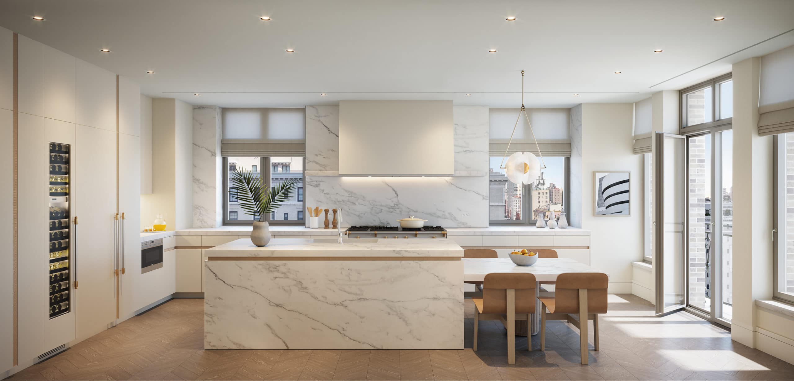 Kitchen at 1228 Madison Ave residences in NYC. White kitchen with center island with marble countertops and backsplash.