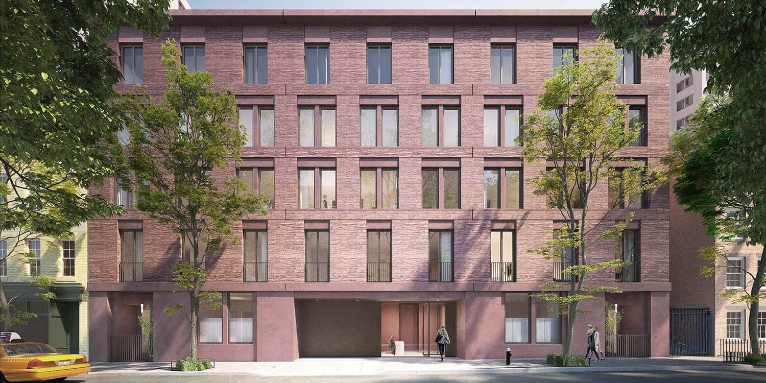 Exterior view of 17 Jane Street condominiums in New York. A 5-story brick residential building with trees.