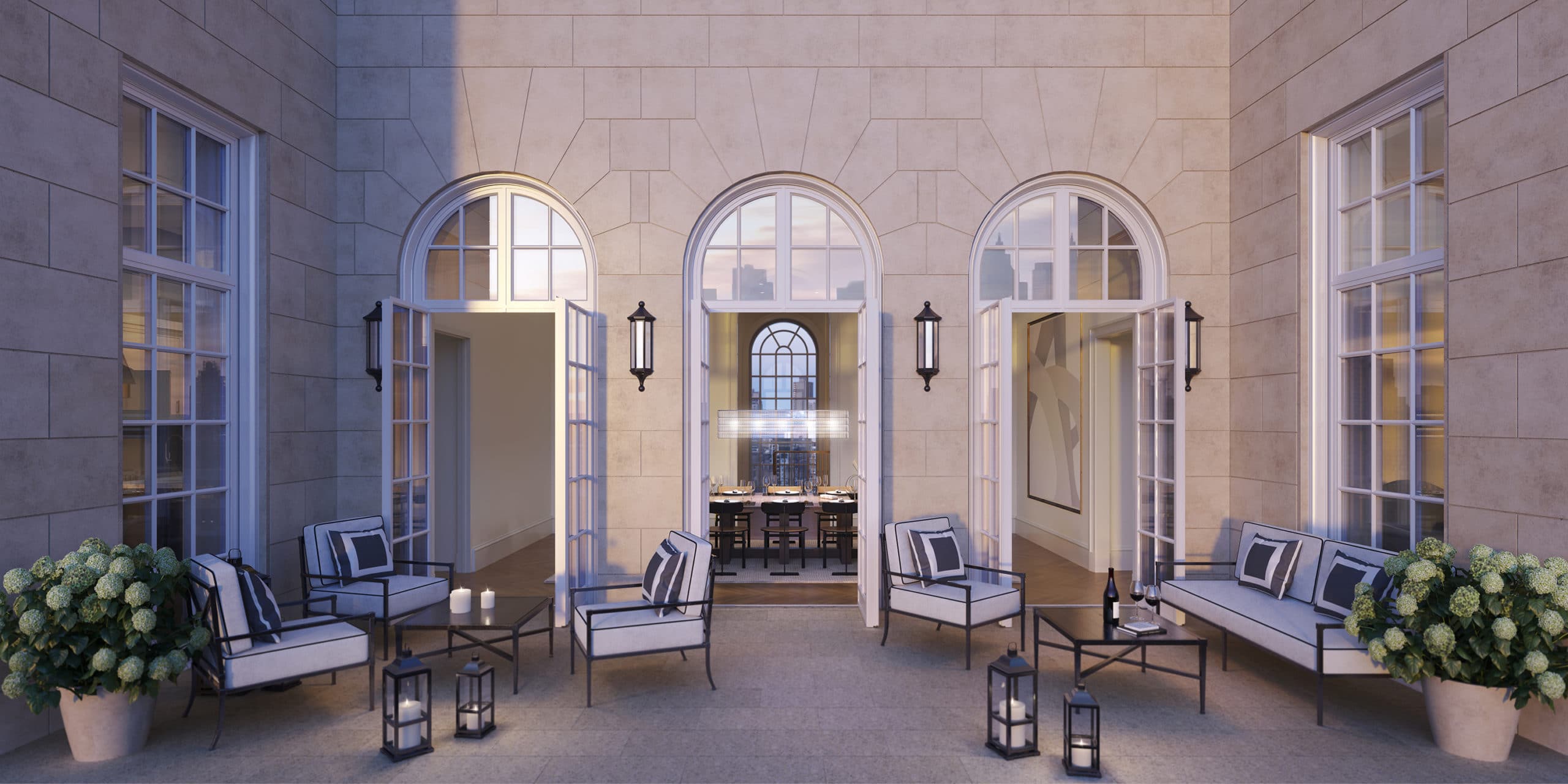 View of penthouse terrace at The Benson condos in New York. Outdoor seating with three doors and two large windows.