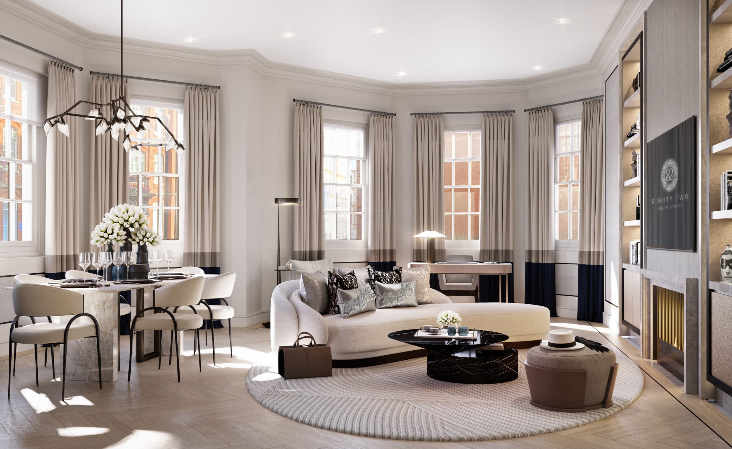 Living room at 82 Mount Street apartments in London. Open room with high ceilings, furniture, fireplace, and dining table.